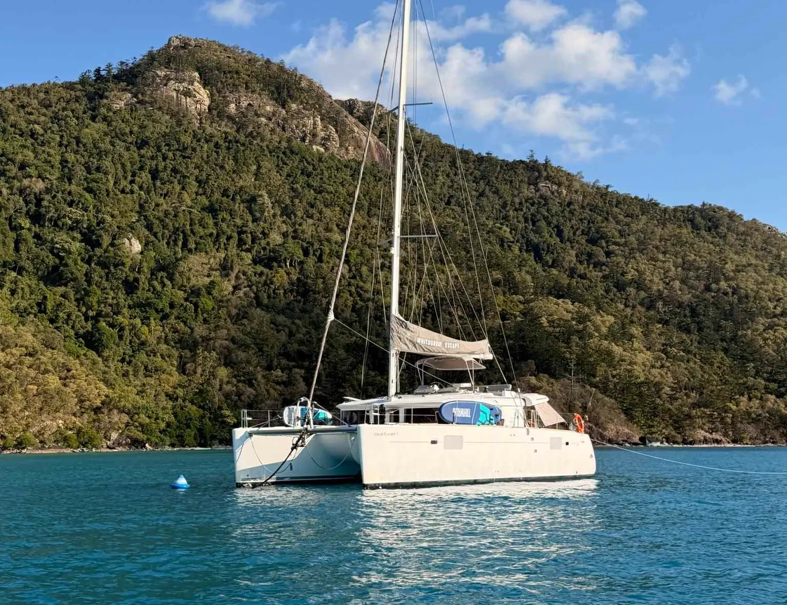 A vessel anchored in a tropical bay.