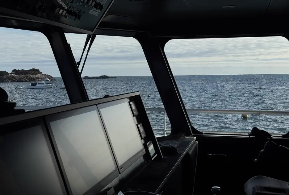 View from the wheelhouse looking out onto the sea.