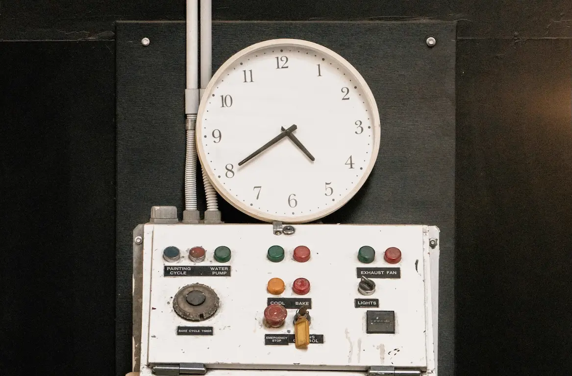 A clock in the machinery control unit of a vessel.